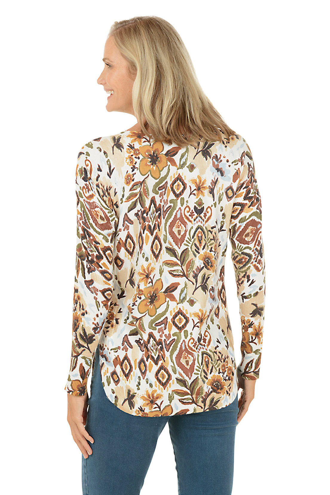 Woman wearing a floral long-sleeve top on a white background. Back shot.