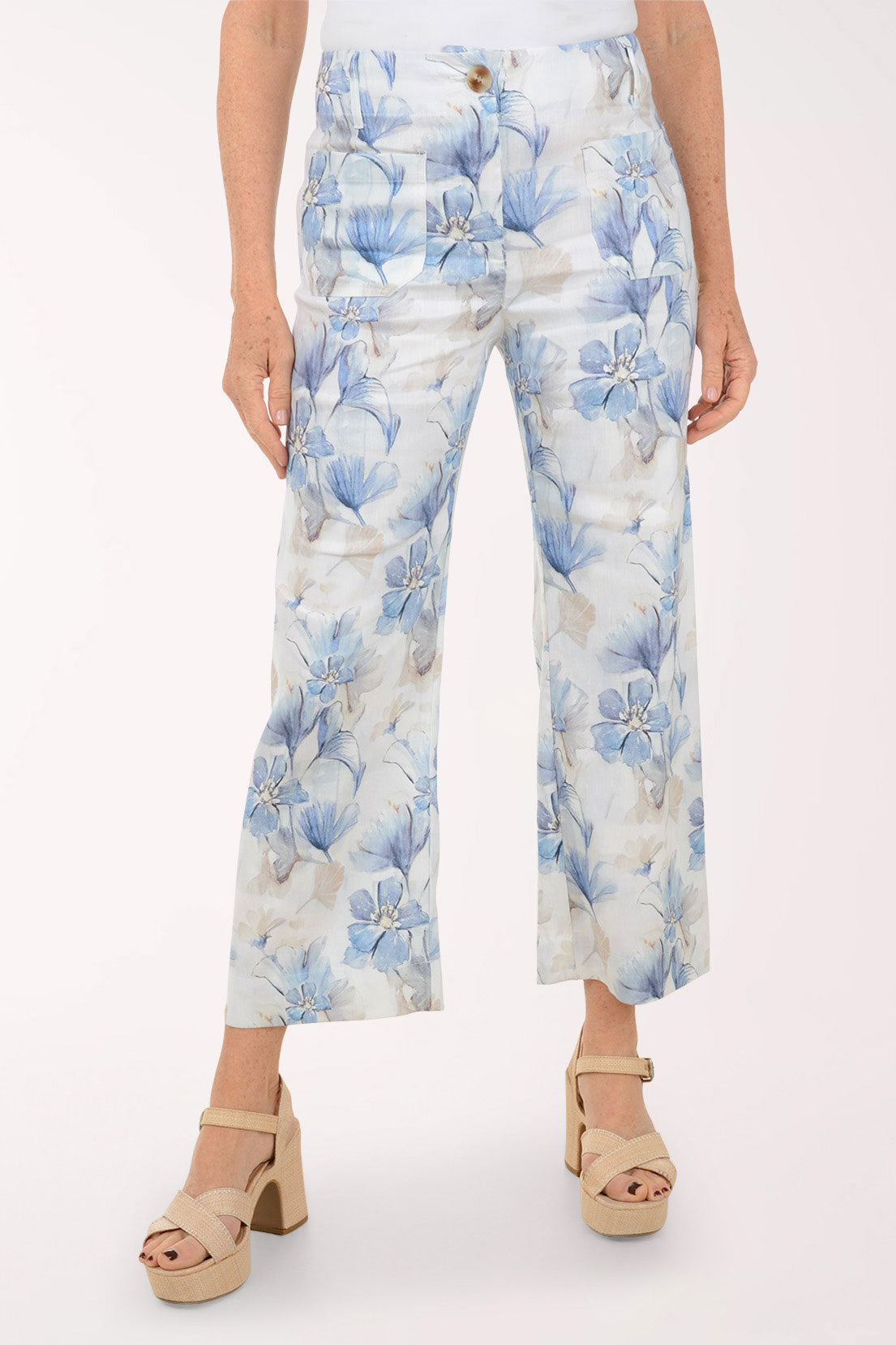 Floral-patterned pants worn by a person on a white background