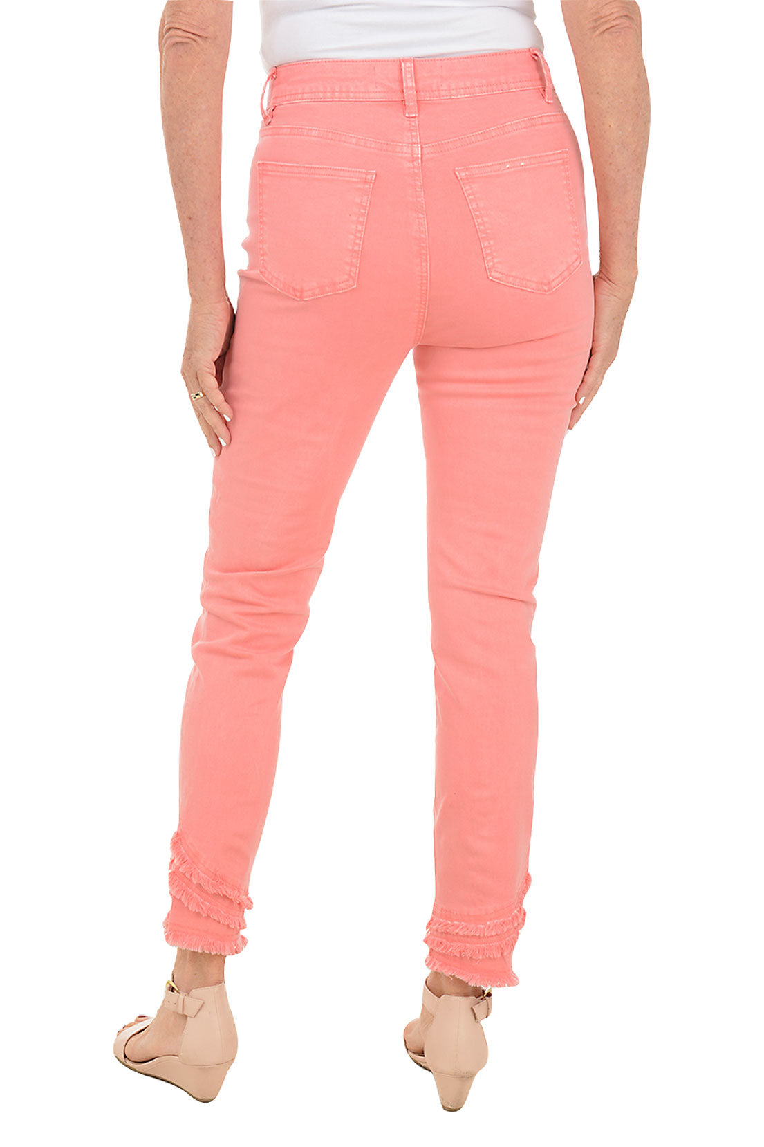 A pair of women's yellow denim crop pants with a frayed hem, displayed on a model without showing the upper part of the body. Back shot.
