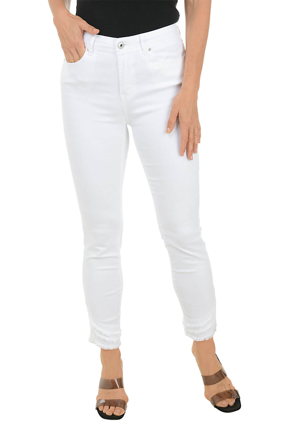 A pair of women's white denim crop pants with a frayed hem, displayed on a model without showing the upper part of the body.
