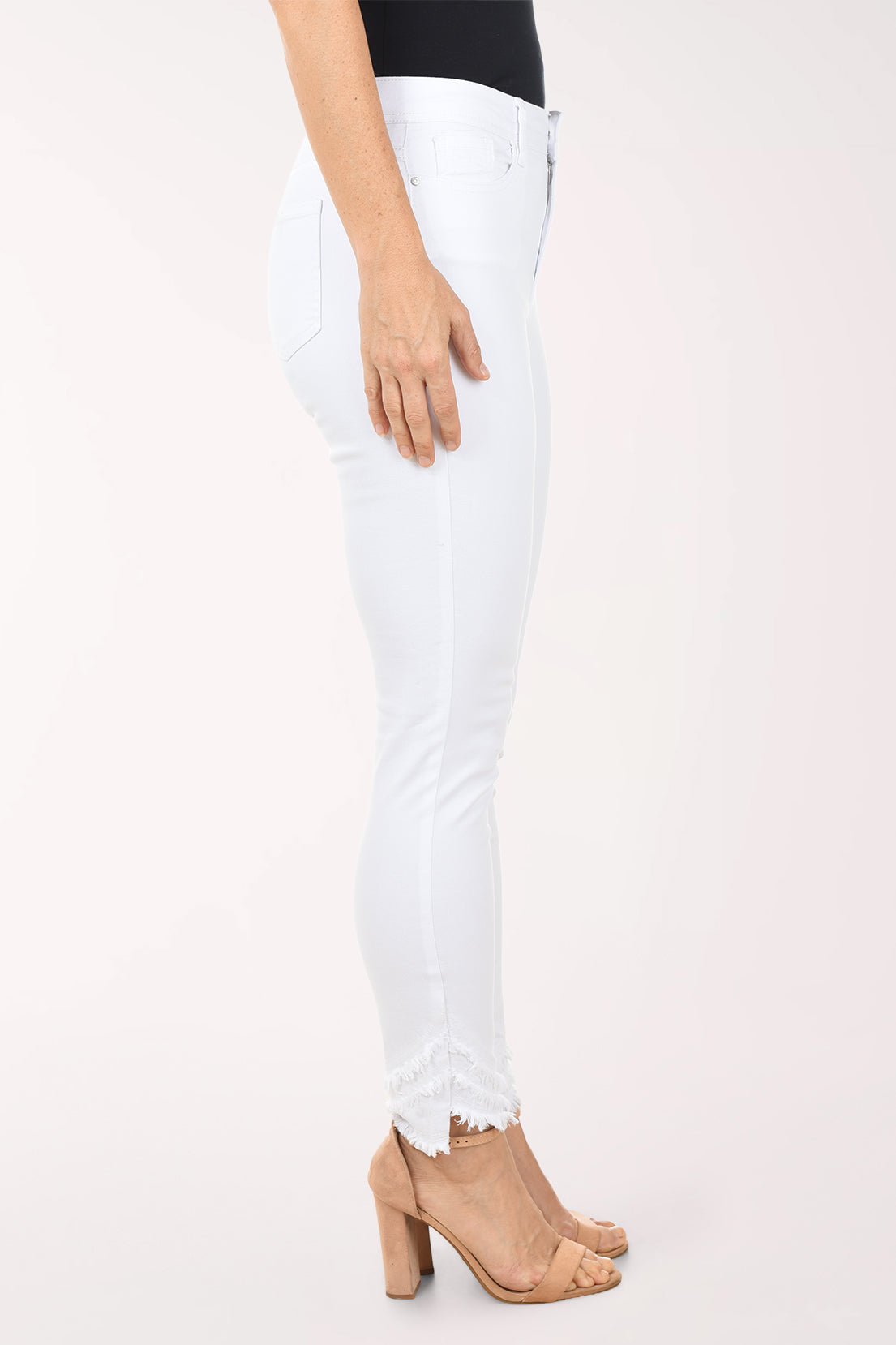 White jeans worn by a person on a white background