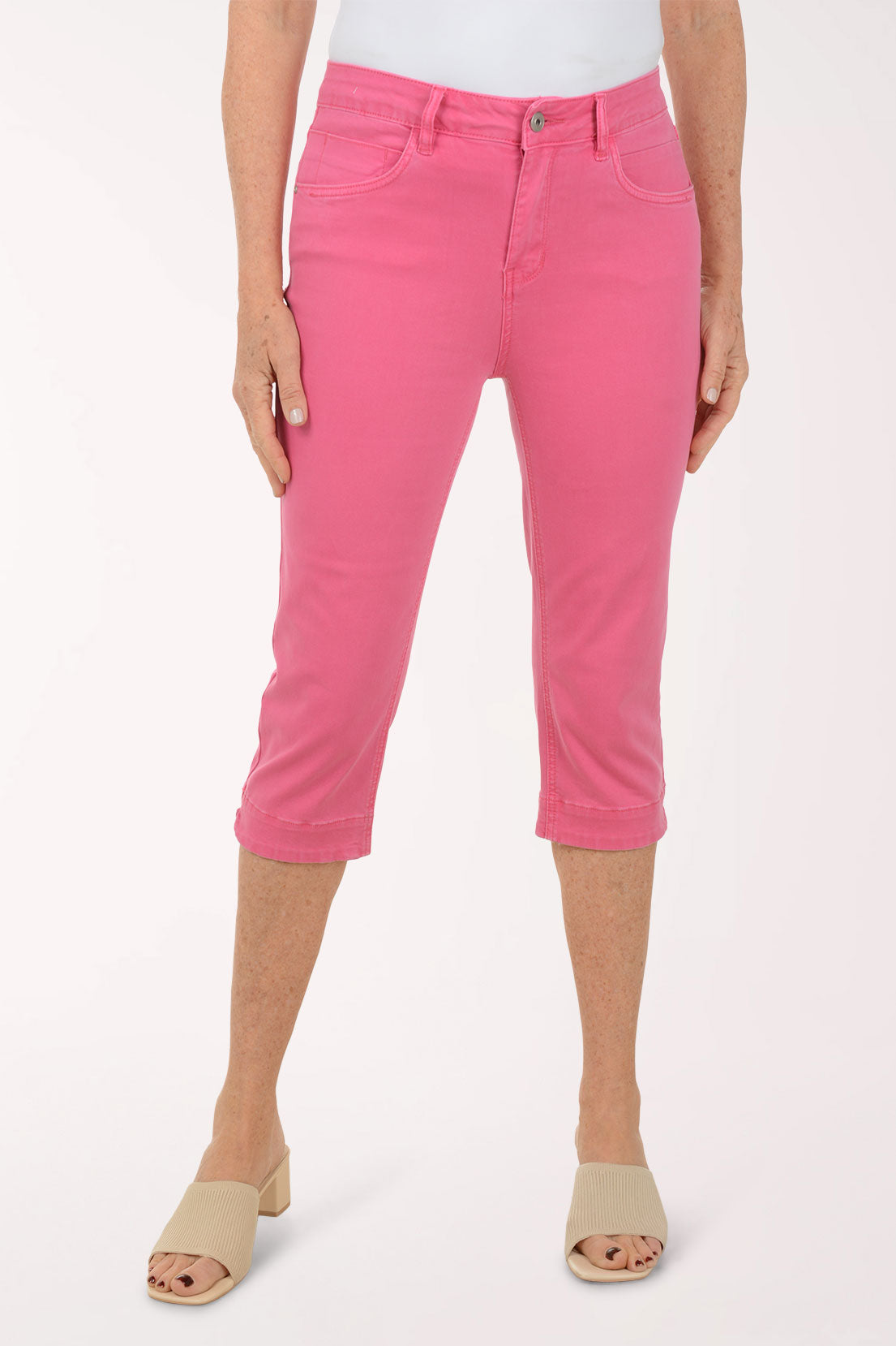 Woman wearing pink crop denim pants.