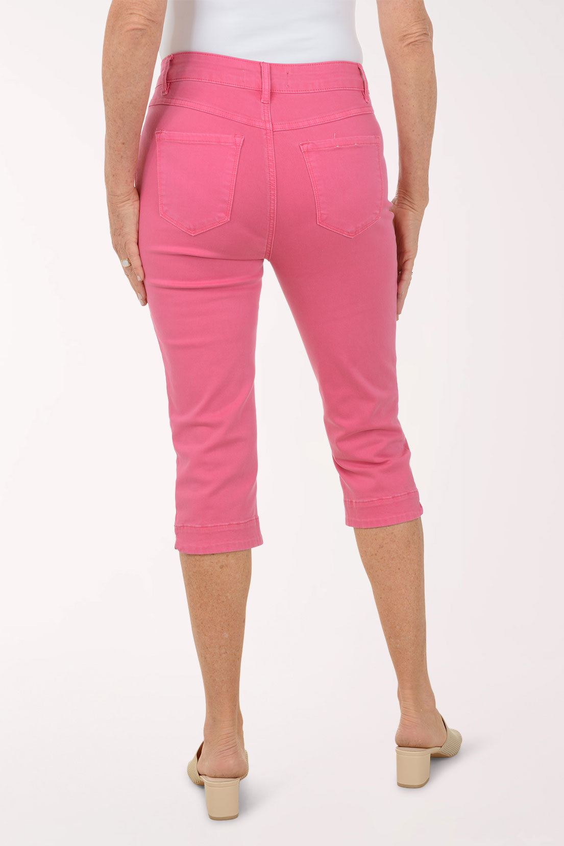 Woman wearing pink crop denim pants.