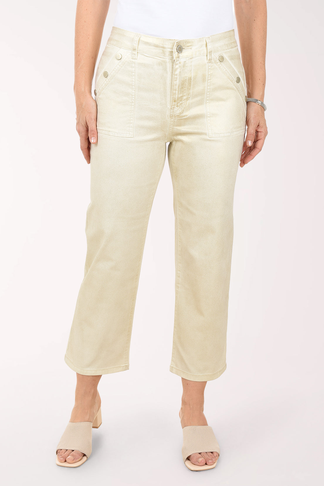 Person wearing light-colored pants on a white background