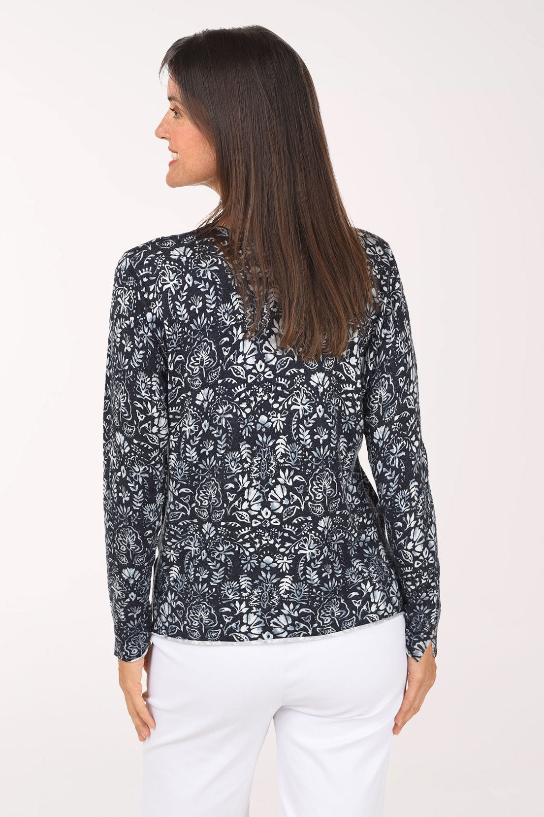 A back view of the navy and white botanical print V-neck sweater.