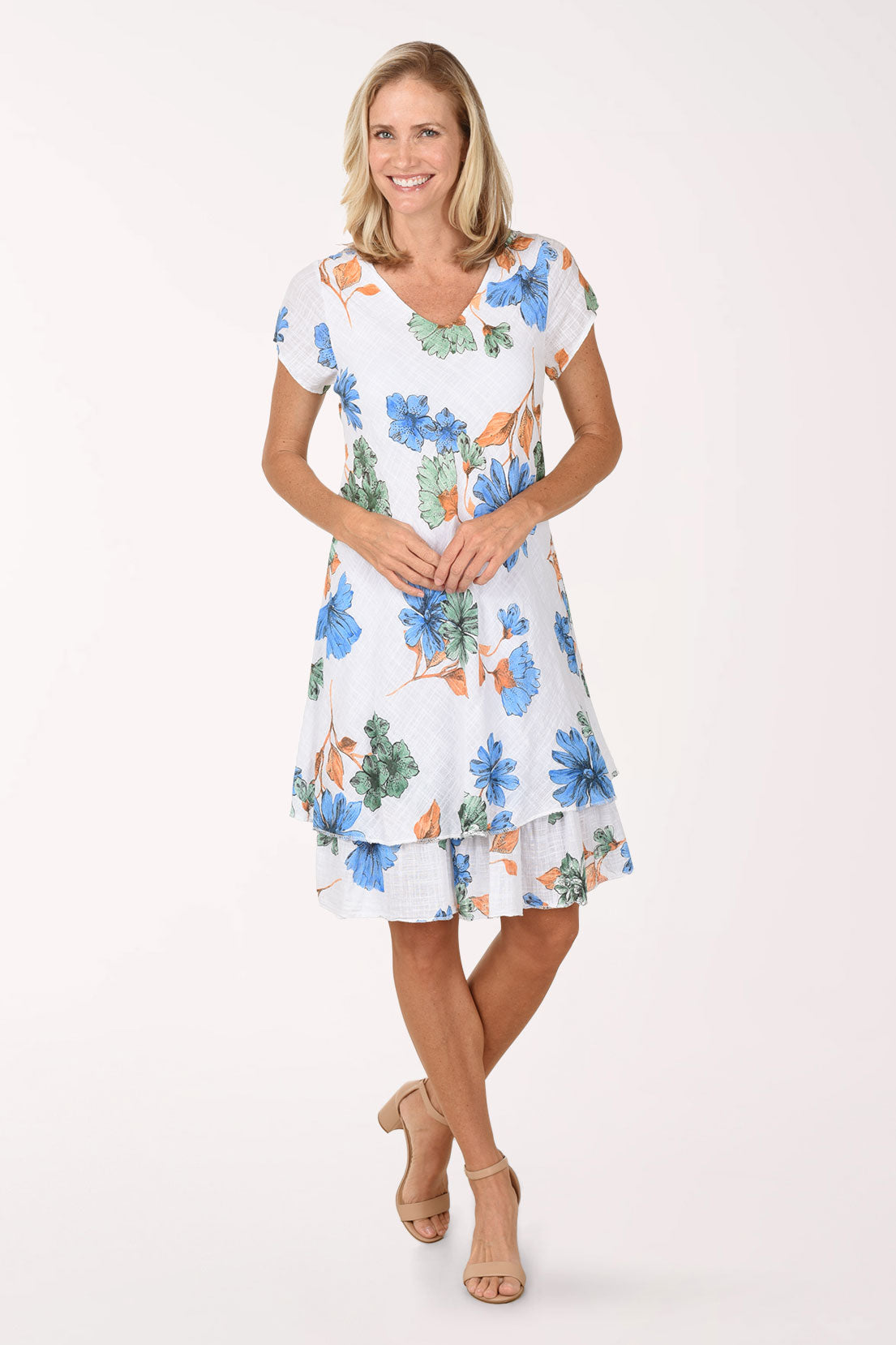 Woman wearing a floral dress on a white background