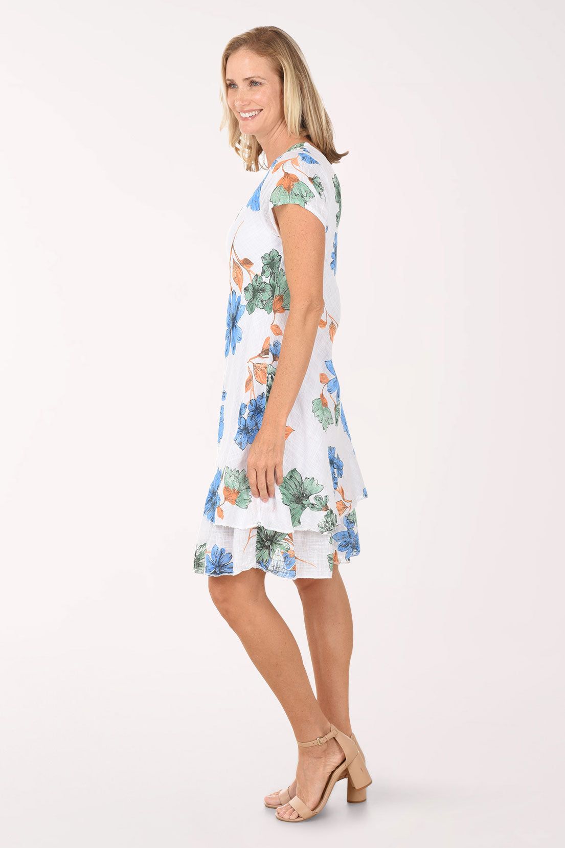Woman wearing a floral dress on a white background