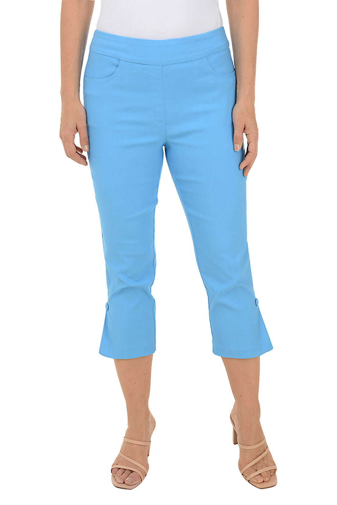 A model wearing turquoise pull-on capri pants with an elasticized waistband, dual front and back pockets, and fabric-covered buttons at the hemline.