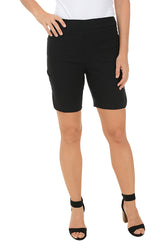A model wearing black pull-on shorts with a 2-inch elasticized waistband, dual front pockets, and a curved tulip hemline with snap button detail.
