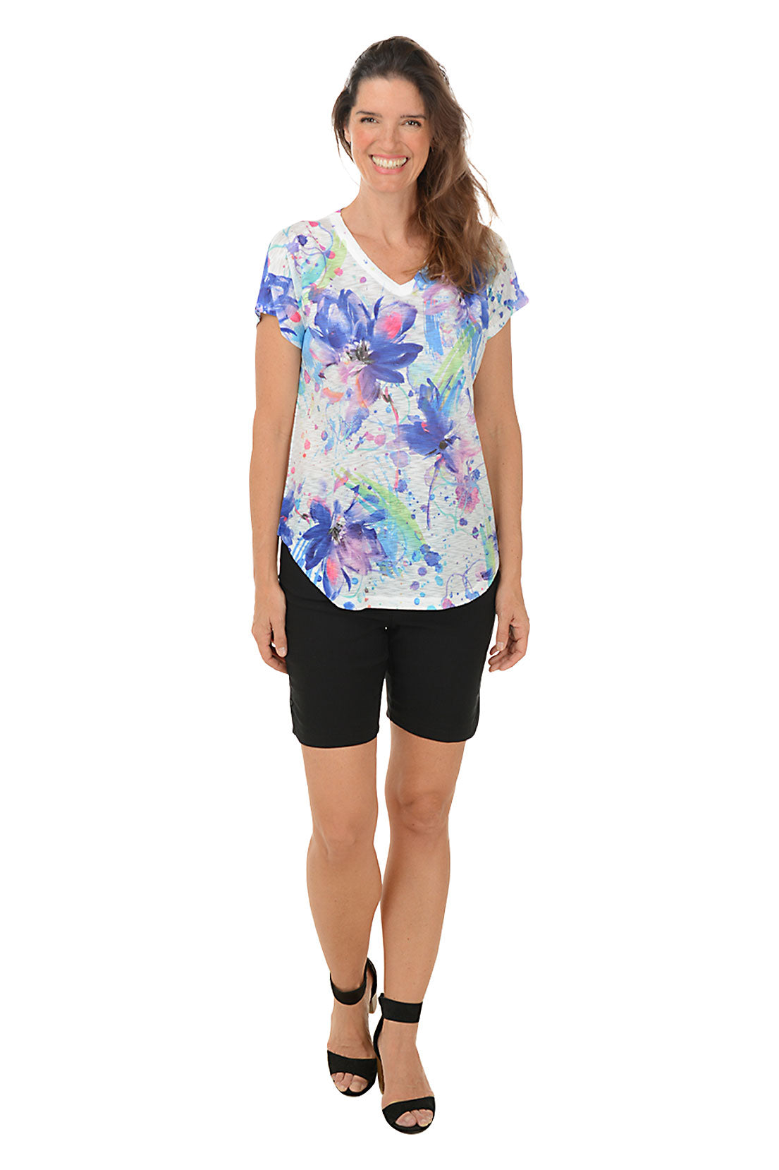 A model wearing black pull-on shorts with a 2-inch elasticized waistband, dual front pockets, and a curved tulip hemline with snap button detail. Second front shot.