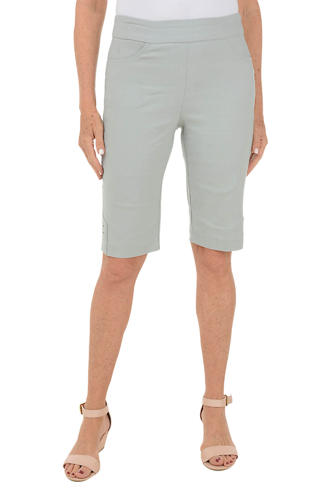 A model wearing grey petite triple grommet hem bermuda shorts with elasticized waistband and dual front pockets.