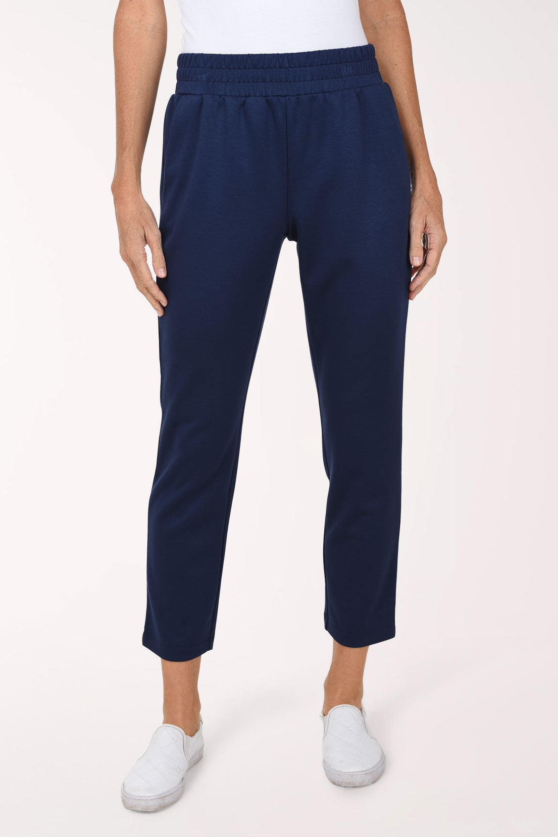 Front close-up of navy Jet Blue scuba straight leg pants showing the smocked pull-on waistband and the straight ankle-length leg.