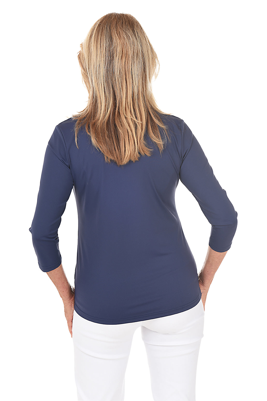 A back shot of a model wearing a navy top with a white background.