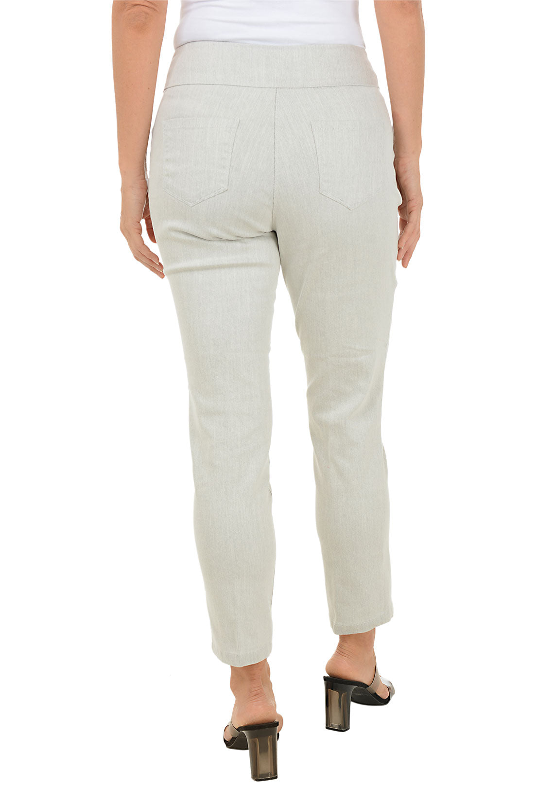 Silver ankle pants worn by a woman on a white background. Back shot.