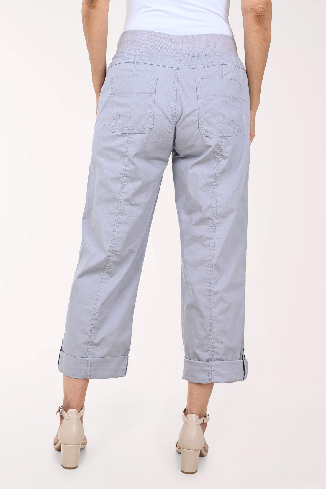 Woman wearing cropped grey pants