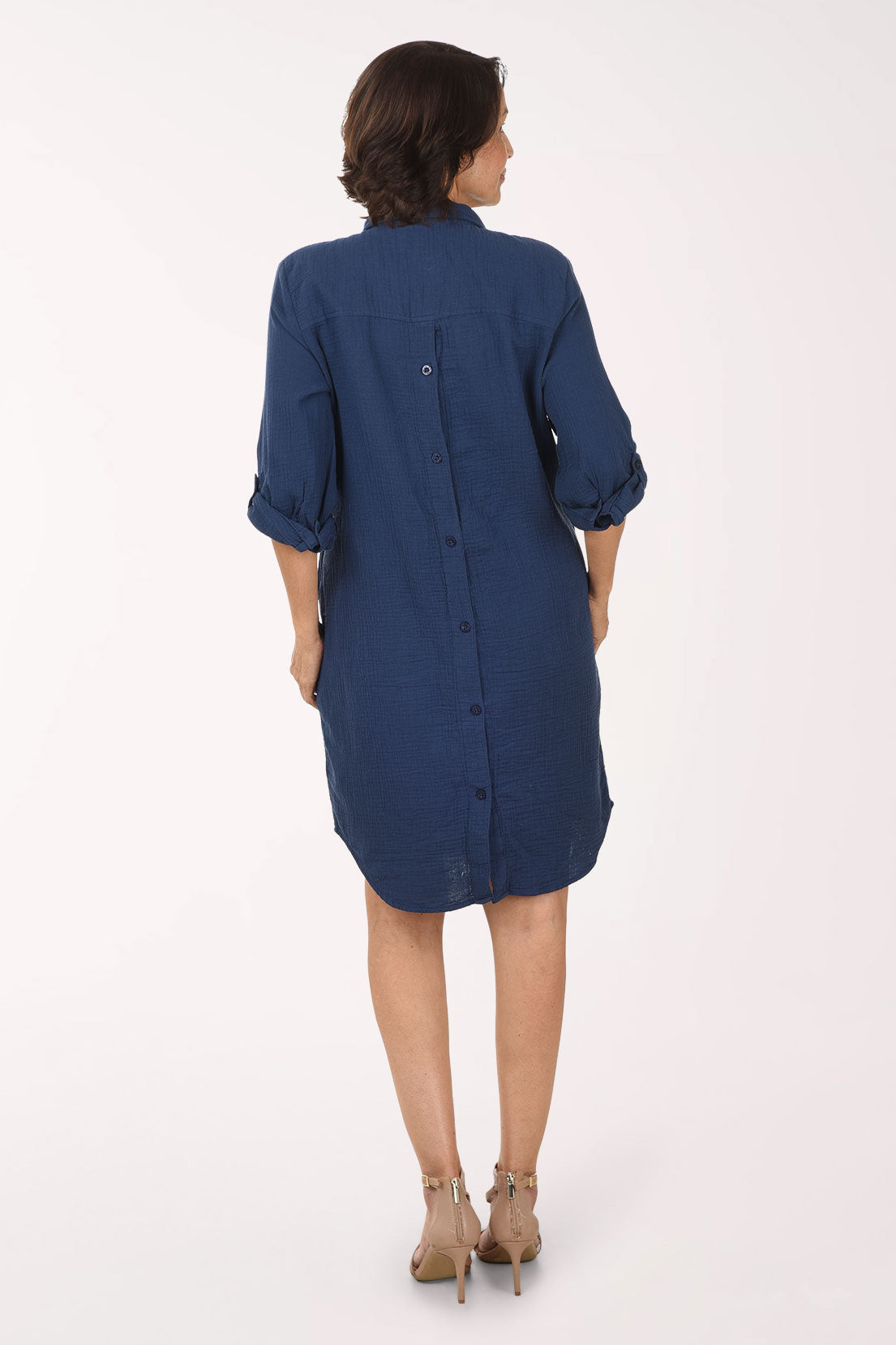 Woman wearing a blue dress on a white background
