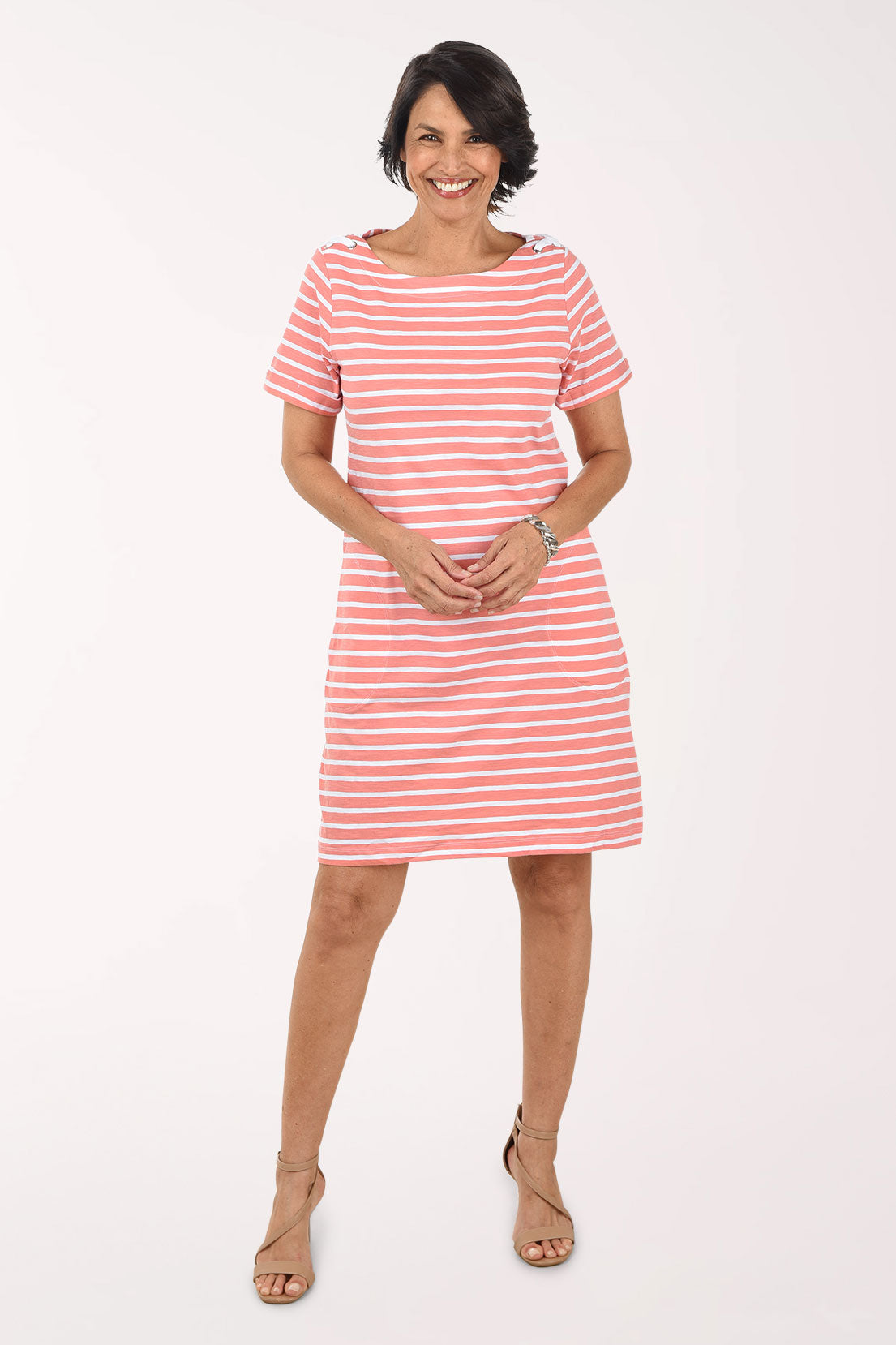 Woman wearing a red and white striped dress on a white background