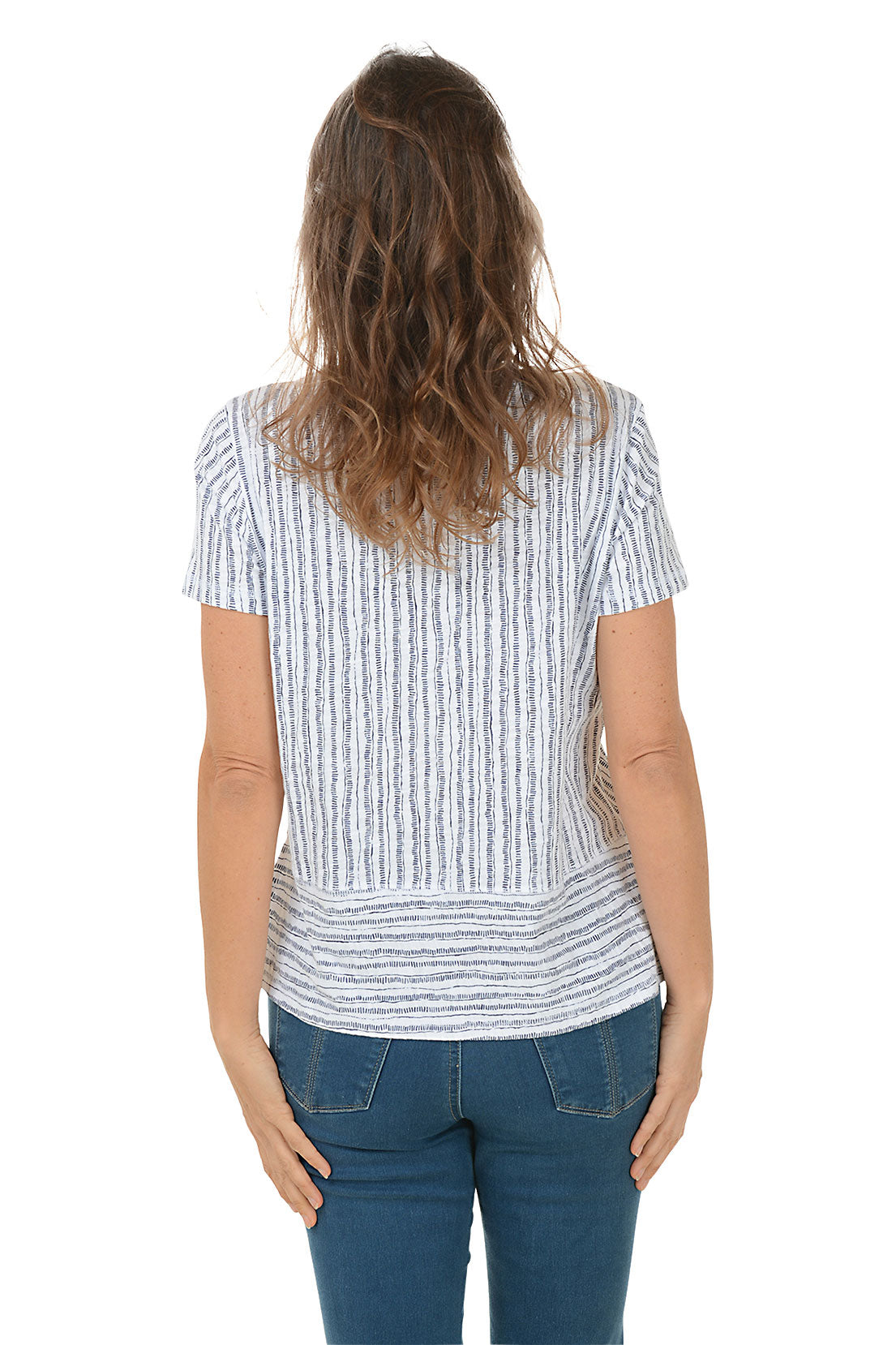 A woman wearing a striped high-low hemline t-shirt with a scoop neckline and short sleeves. Back shot.