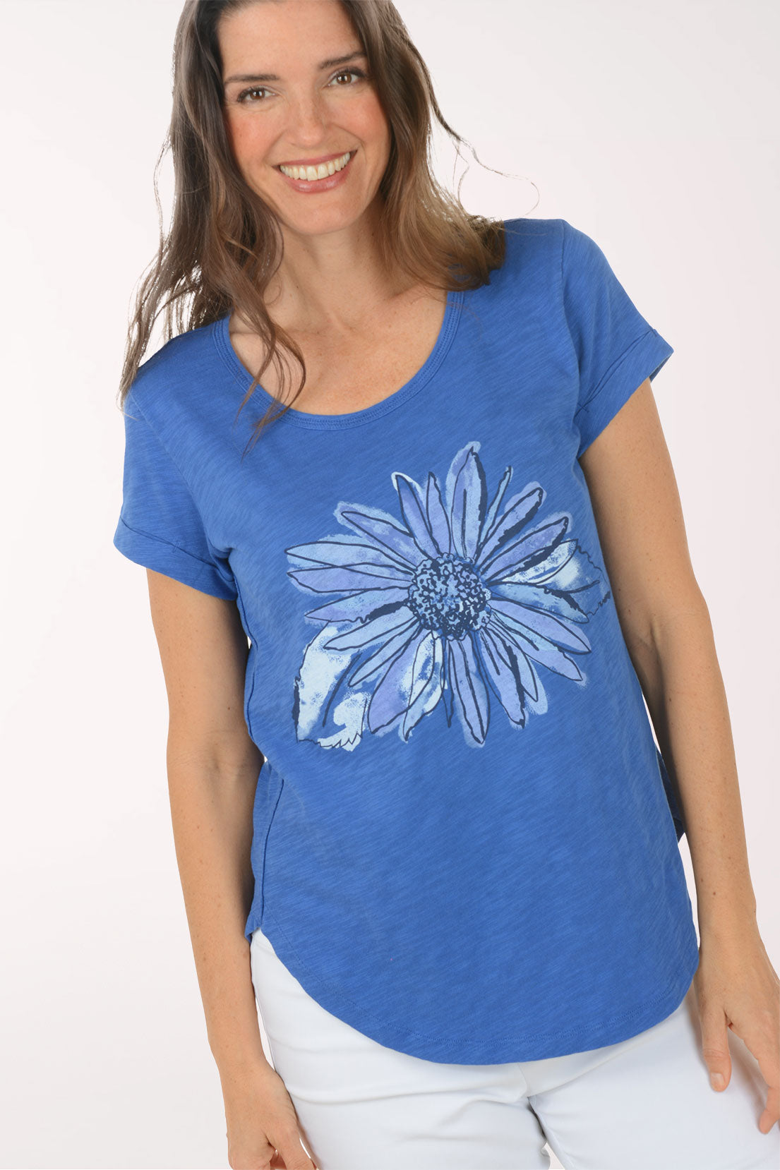 A woman wearing a short sleeve blue top.