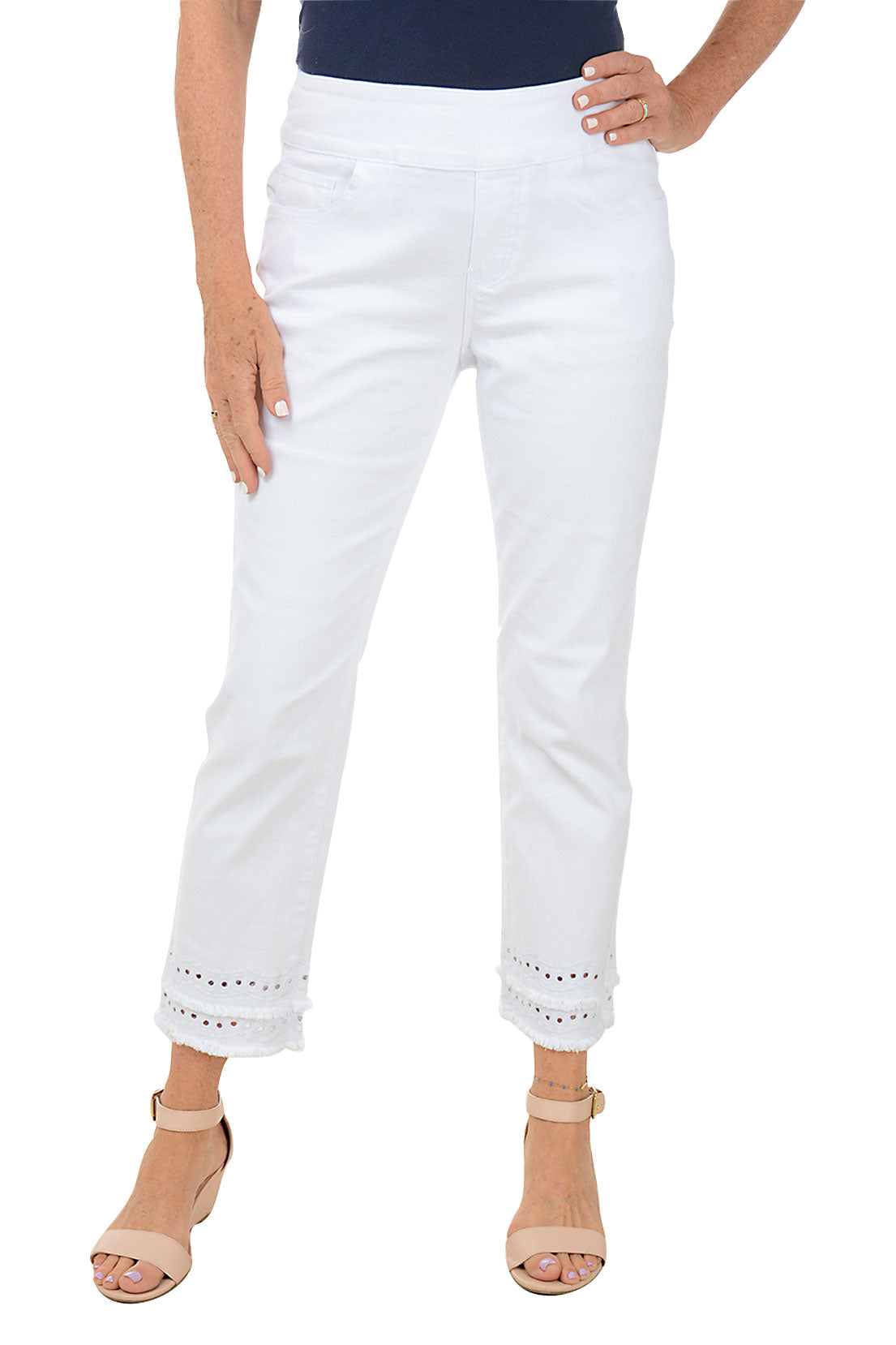 A woman wearing a white denim ankle pant with a double tiered raw hem.