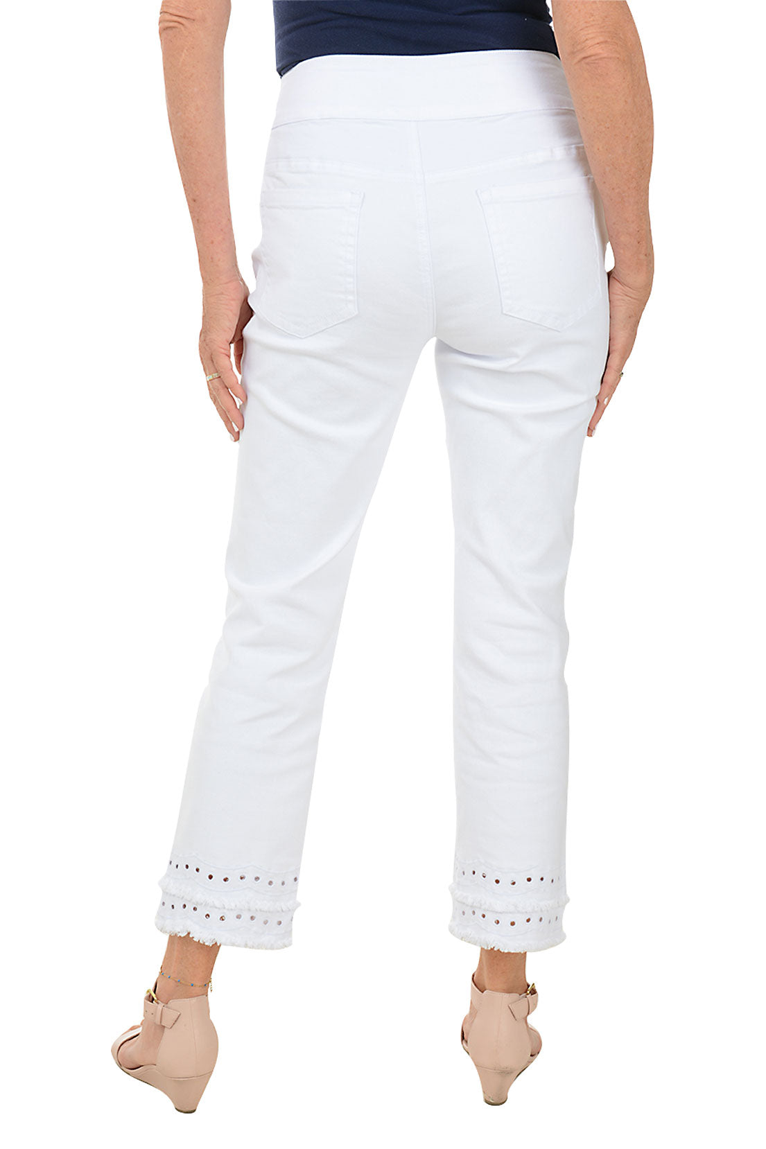 A woman wearing a white denim ankle pant with a double tiered raw hem. Back shot.