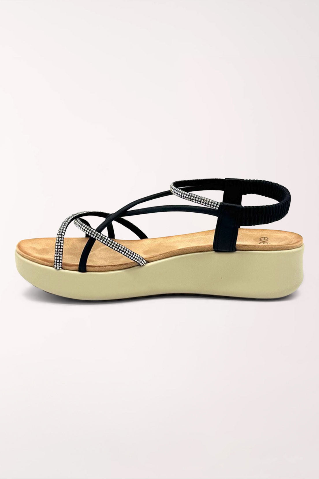 Inner side view of the black wedge sandal showing the rhinestone-edged straps and slingback.