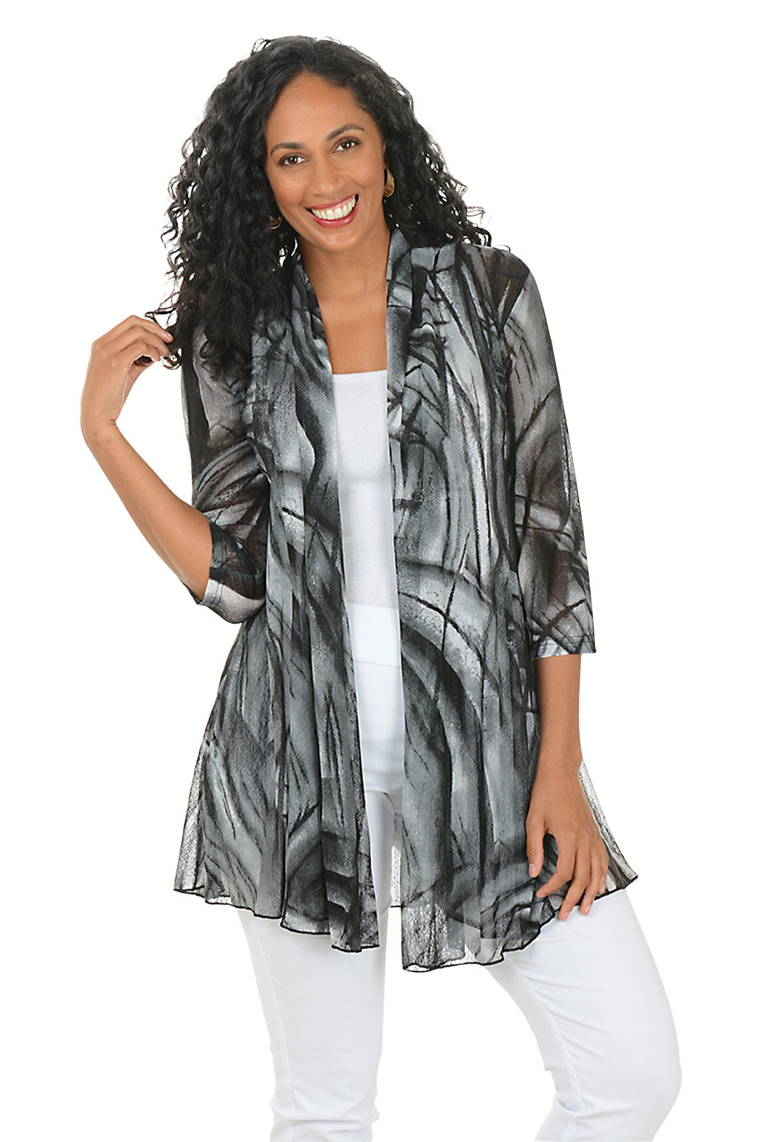 Woman wearing a black and gray patterned cardigan on a white background.