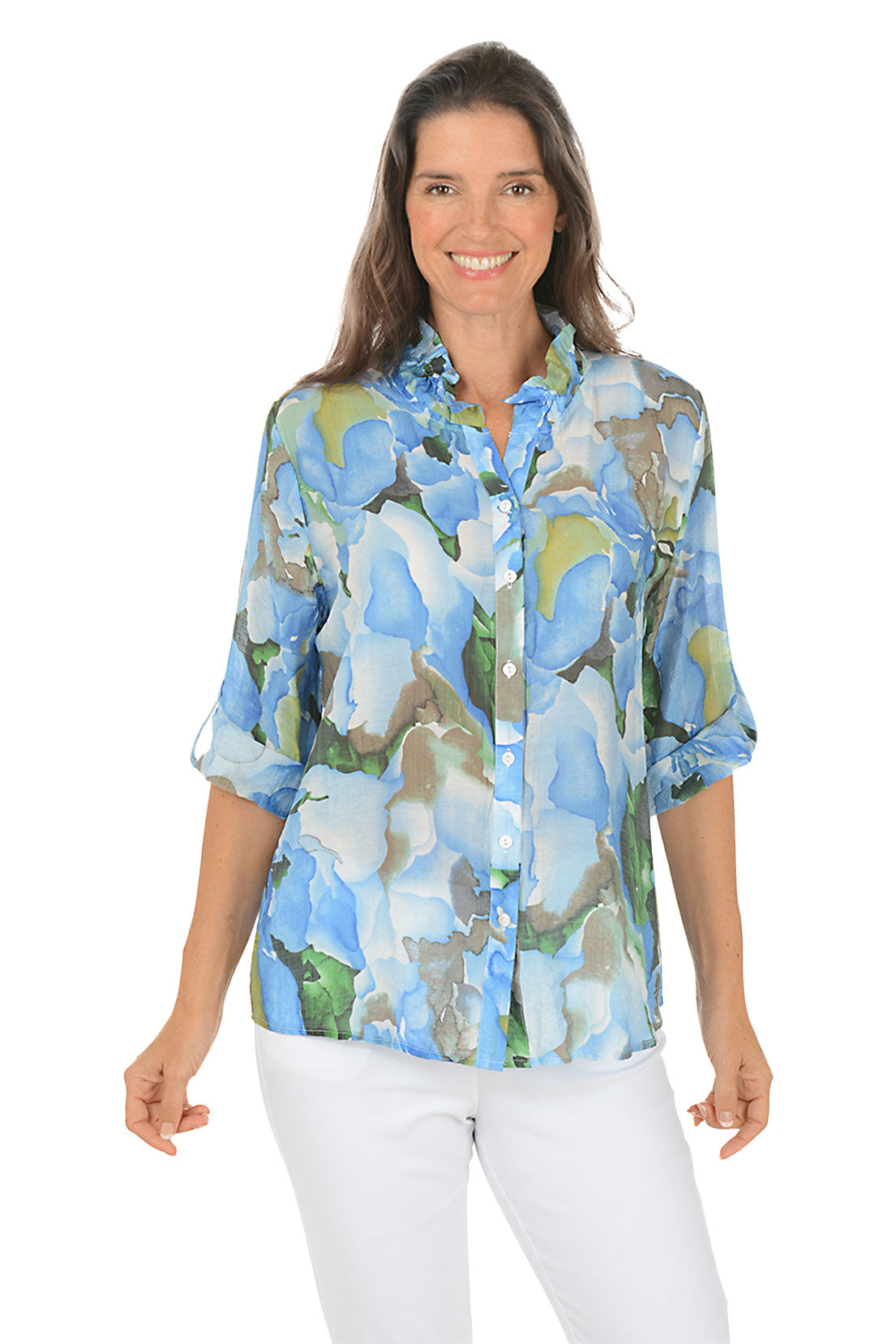 Woman wearing a floral blouse with a white background.