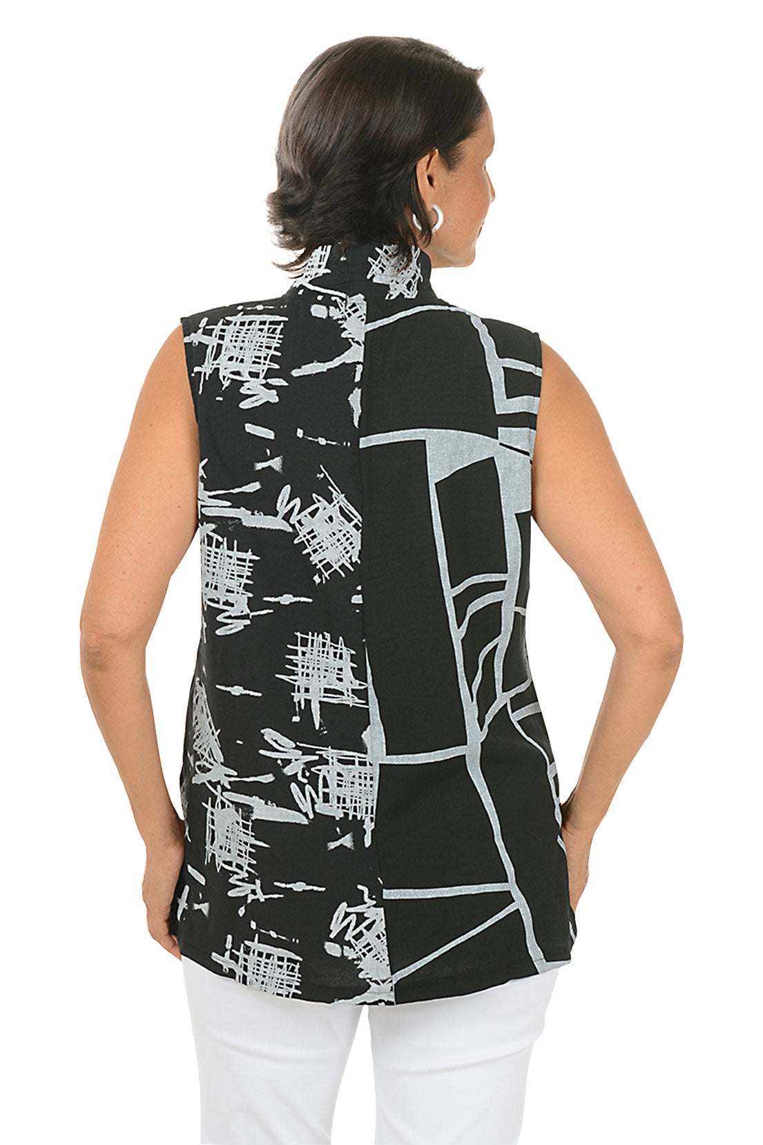 Woman wearing a sleeveless black top with white and red patterns on a white background. Back shot.