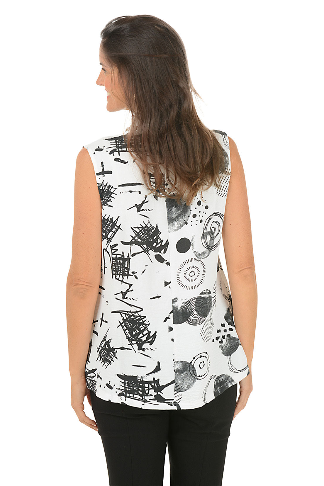 Woman wearing a sleeveless top with black and white abstract pattern on a white background. Back shot.