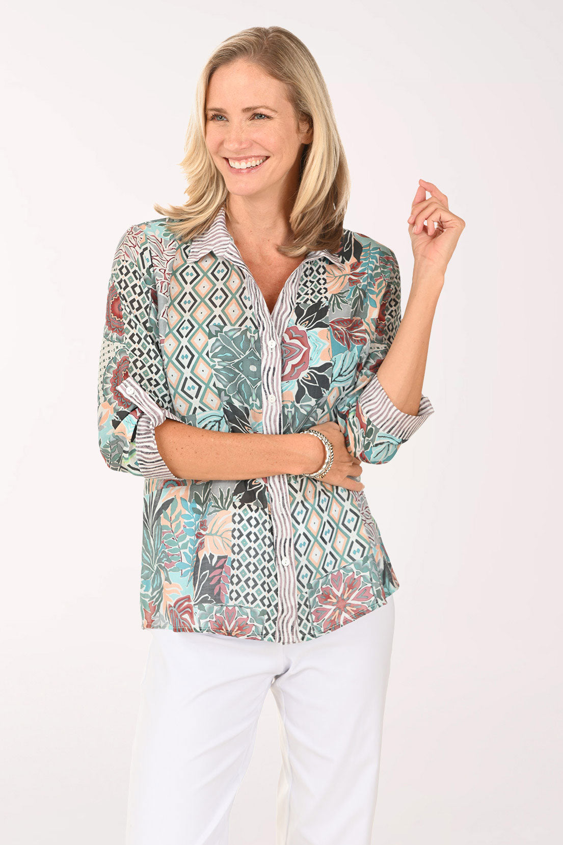 Woman wearing a multi colored roll sleeve top