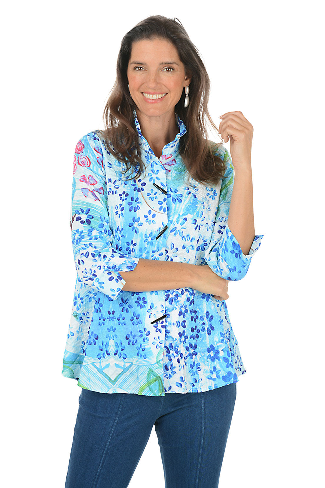 Woman wearing a blue floral blouse on a white background