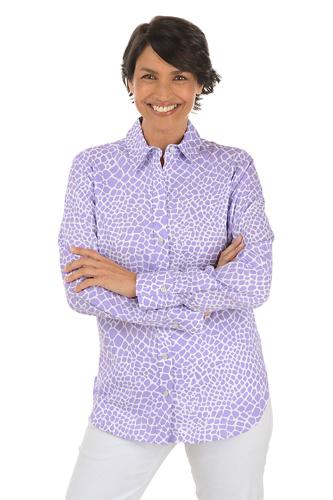 A front shot of a model wearing a long sleeve buttoned shirt with a geometric pattern, in a corporate setting.