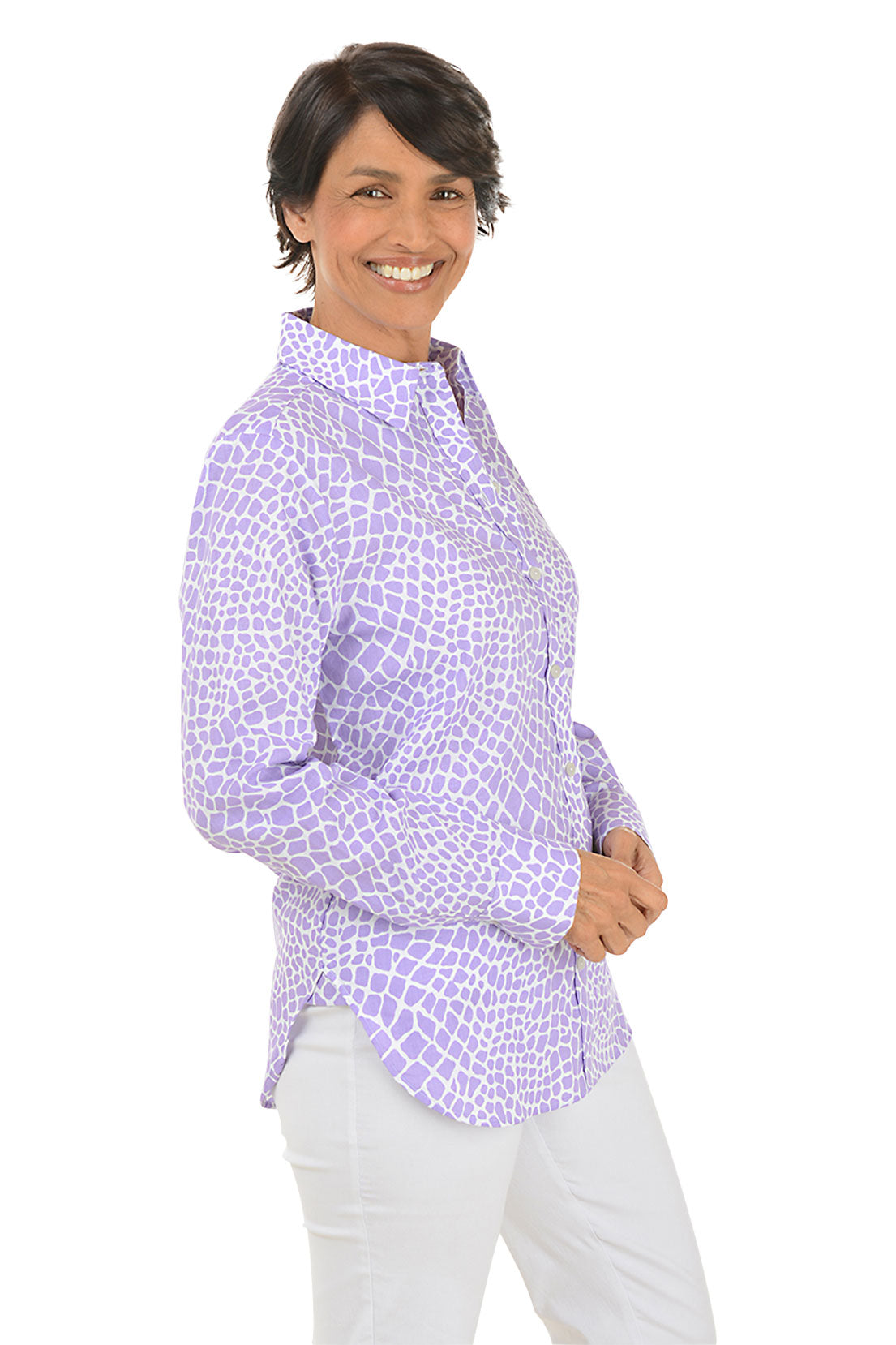 A side shot of a model wearing a long sleeve buttoned shirt with a geometric pattern, in a corporate setting color Amethyst