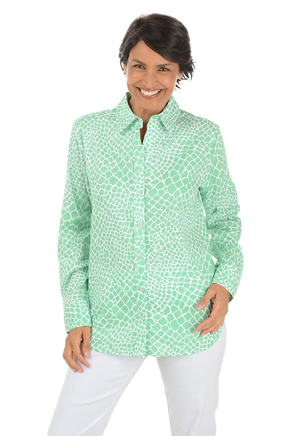 A front shot of a model wearing a long sleeve buttoned shirt with a geometric pattern, in a corporate setting color leaf green.