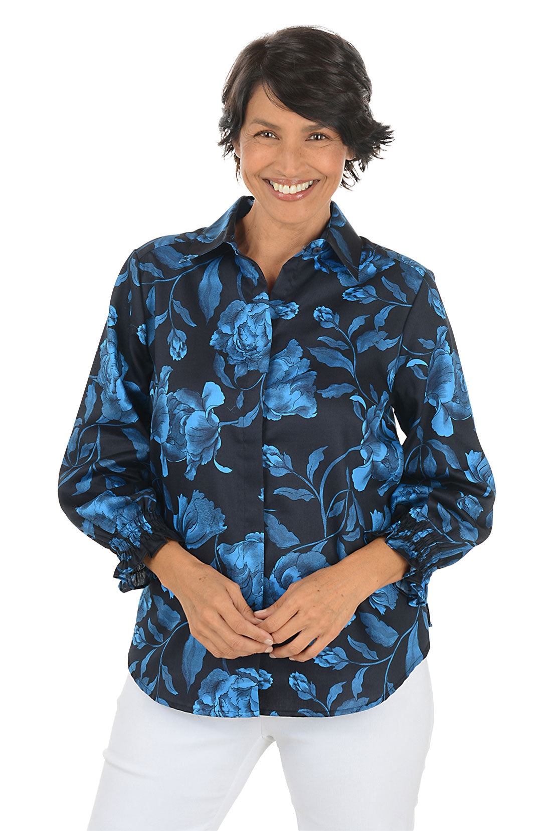Woman wearing a blue floral patterned shirt on a white background