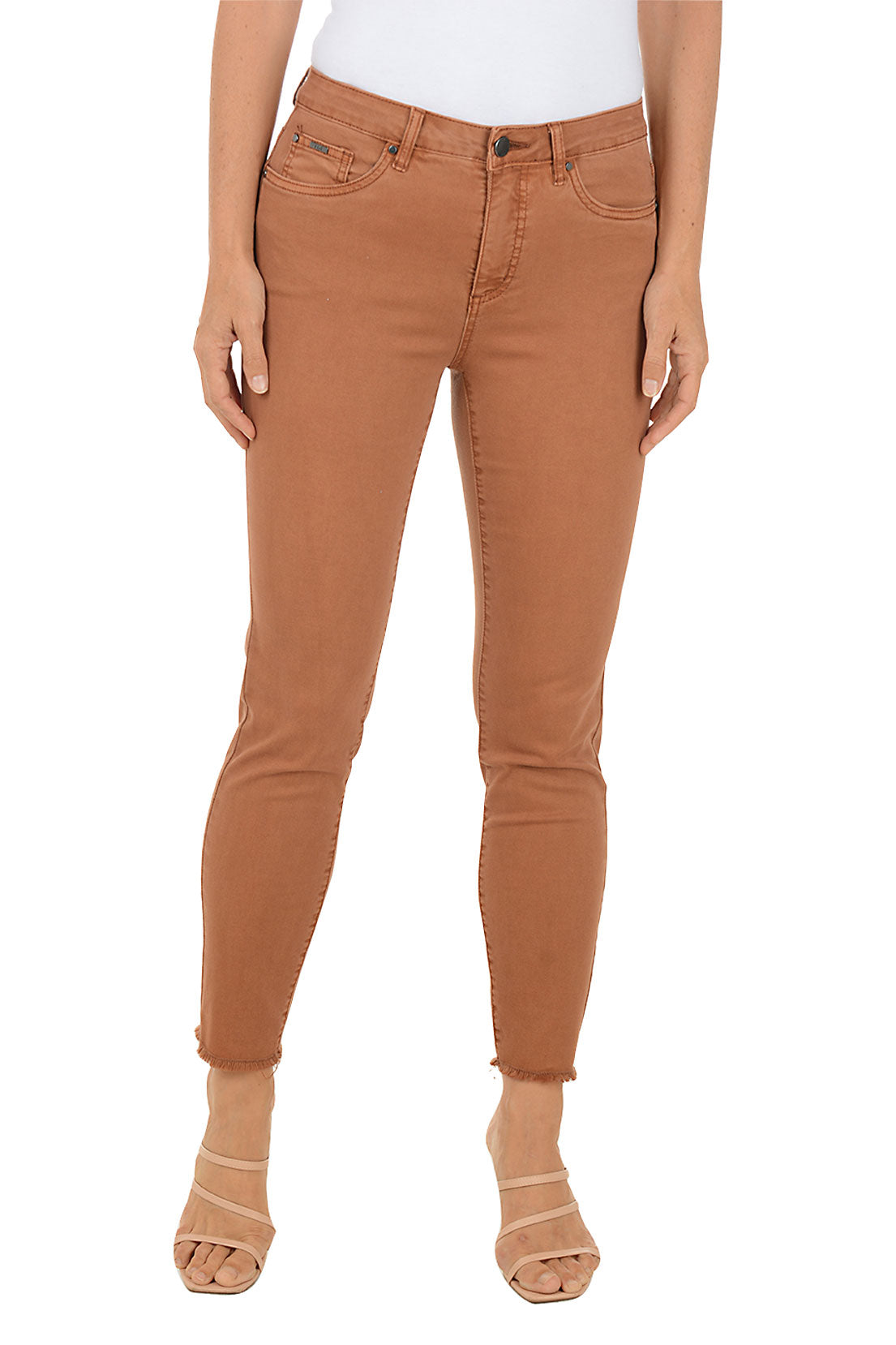 Person wearing brown jeans on a white background