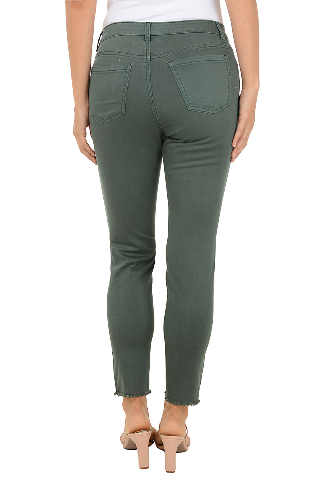 Person wearing green ankle jeans on a white background. Back shot.