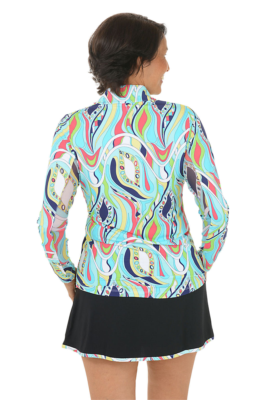 Woman wearing a colorful patterned jacket and black skirt on a white background. Back shot.