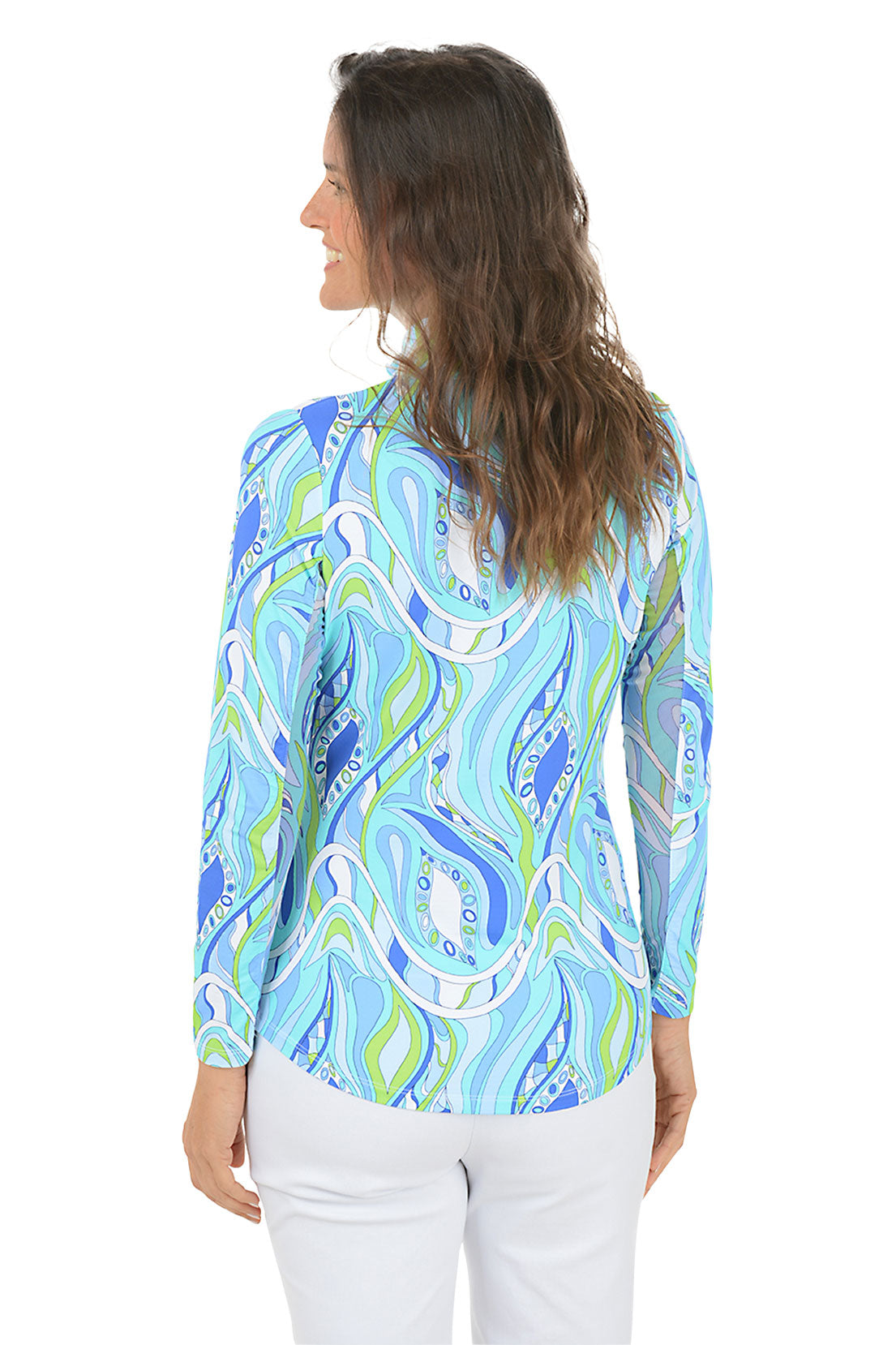 Woman wearing a blue and green patterned shirt on a white background. Back shot.