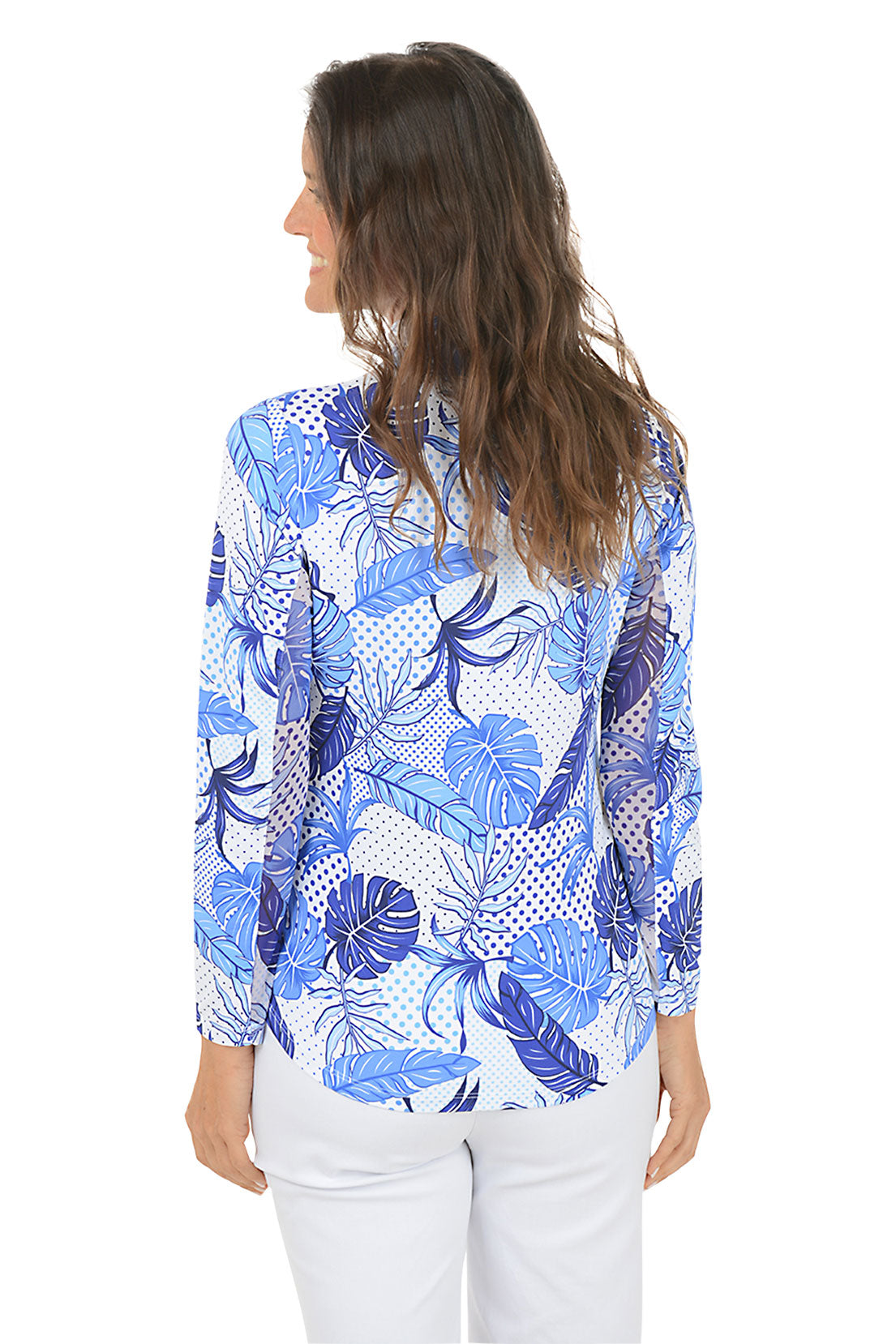 Woman wearing a blue and white floral patterned blouse on a white background. Back shot.
