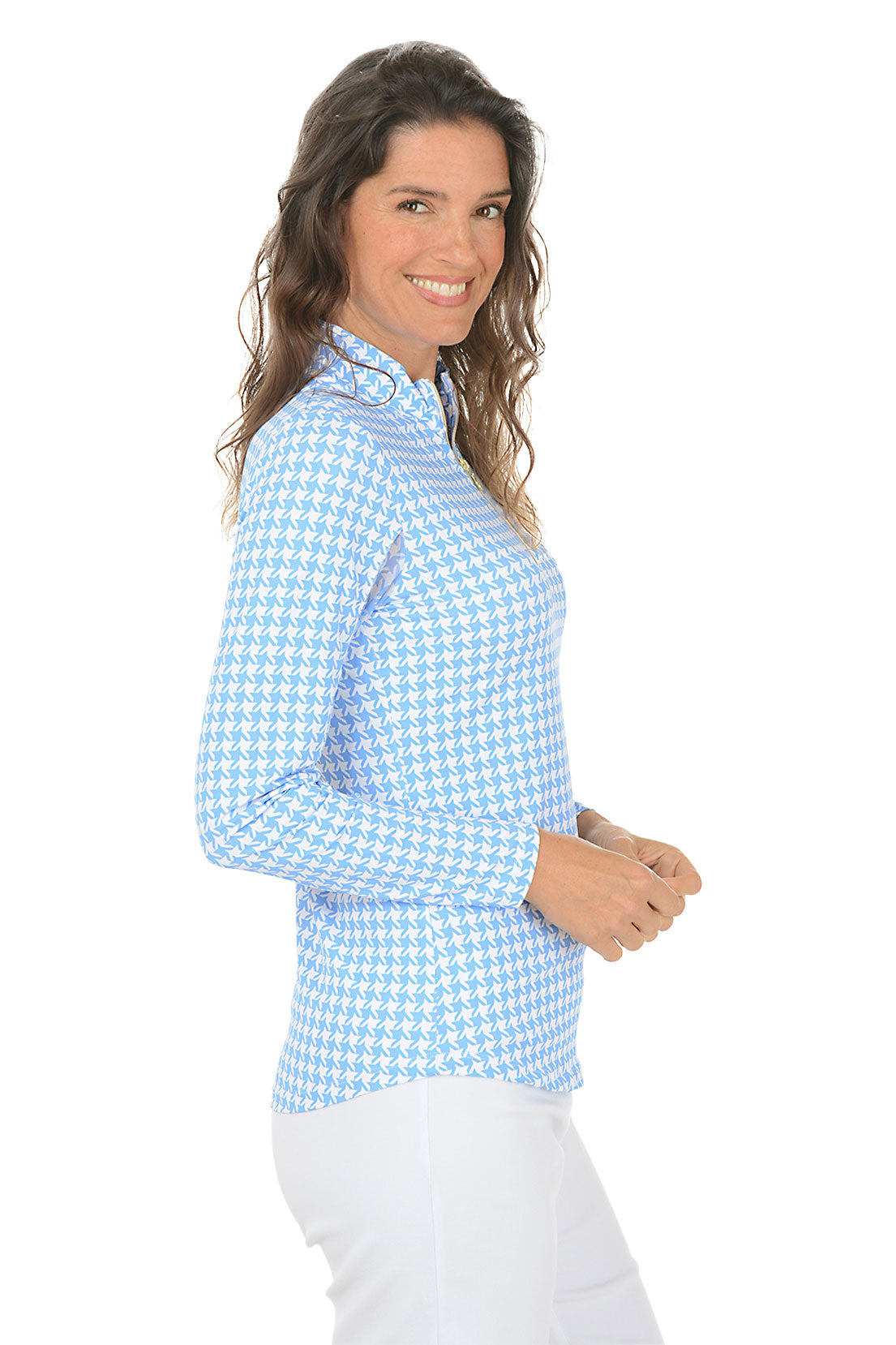 Woman wearing a blue and white checkered long-sleeve shirt with mesh sleeves on a white background. Side shot.