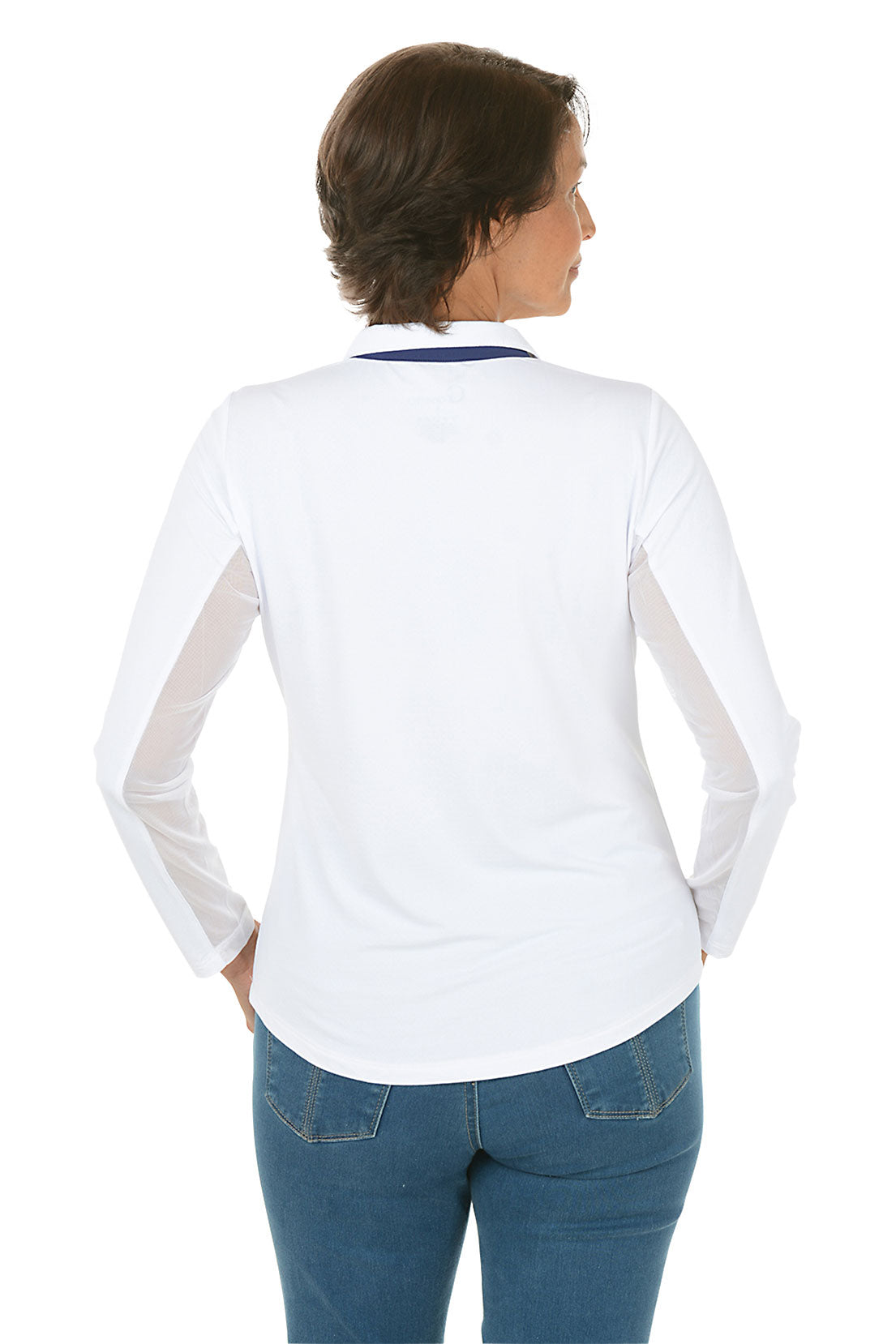 Woman wearing a white long-sleeve shirt and blue jeans on a white background. Back shot.