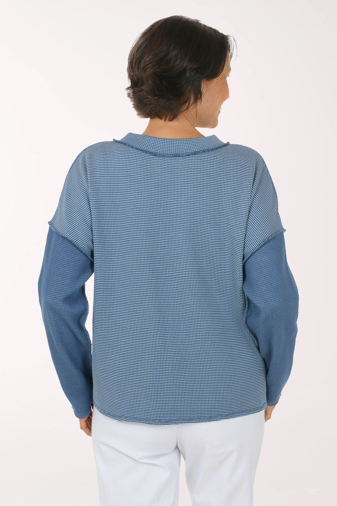 Woman wearing a blue sweater