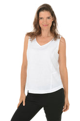 A front shot of a model wearing a white sleeveless tank top with a V-neckline and triple button styling on shoulder straps, paired with black pants.