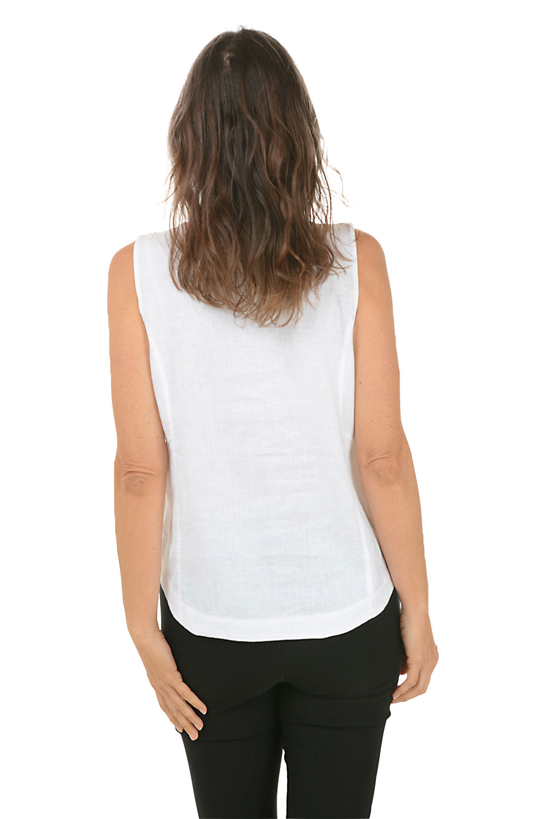 A back shot of a model wearing a white sleeveless tank top with a V-neckline and triple button styling on shoulder straps, paired with black pants.