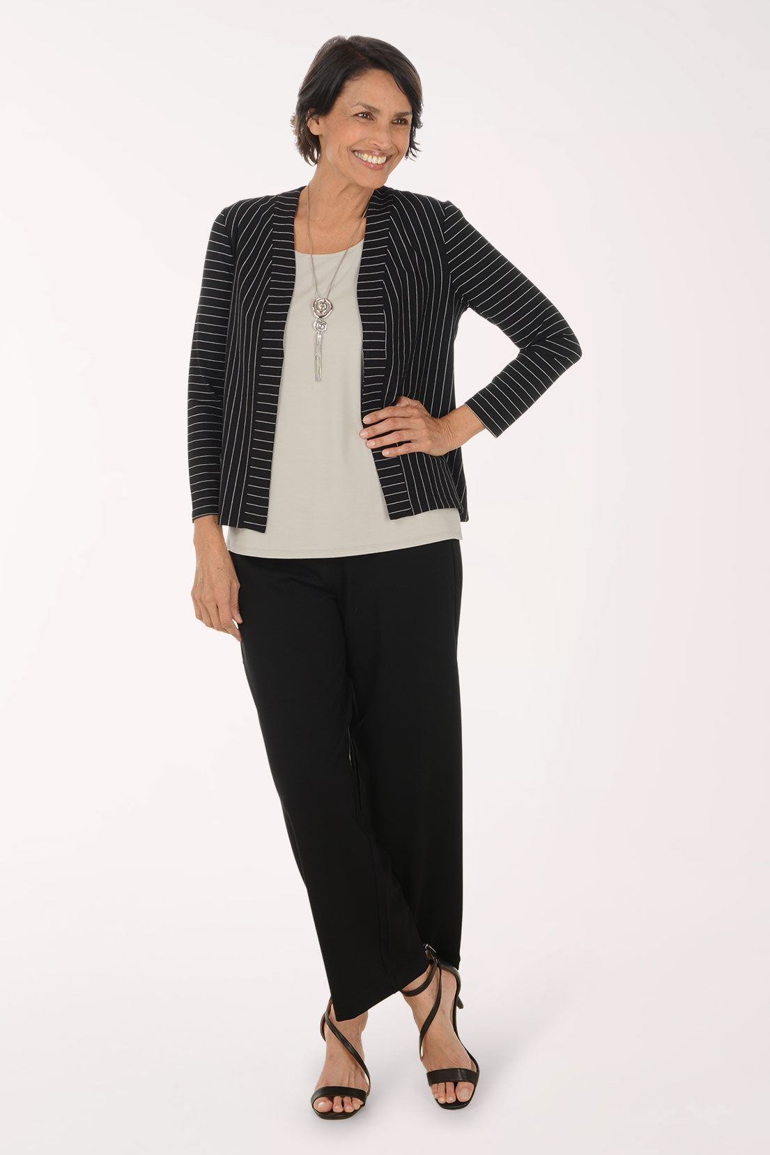 Woman wearing black full length pants