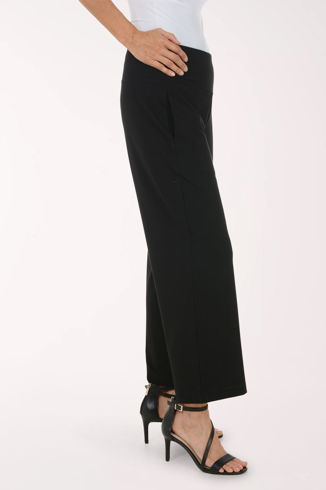 Woman wearing black full length pants