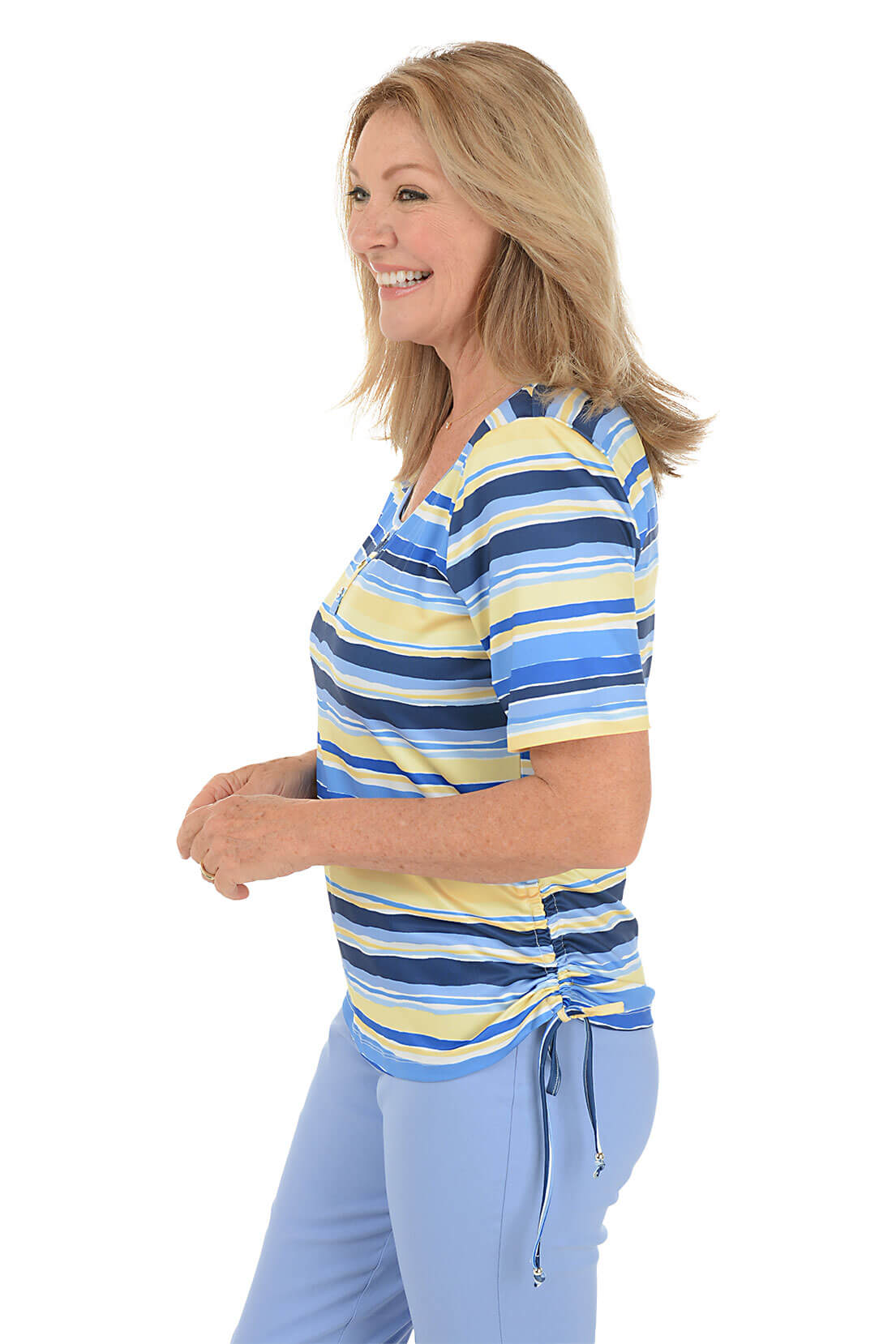 A side shot of a model wearing a striped henley top with short sleeves, featuring blue and yellow colors.