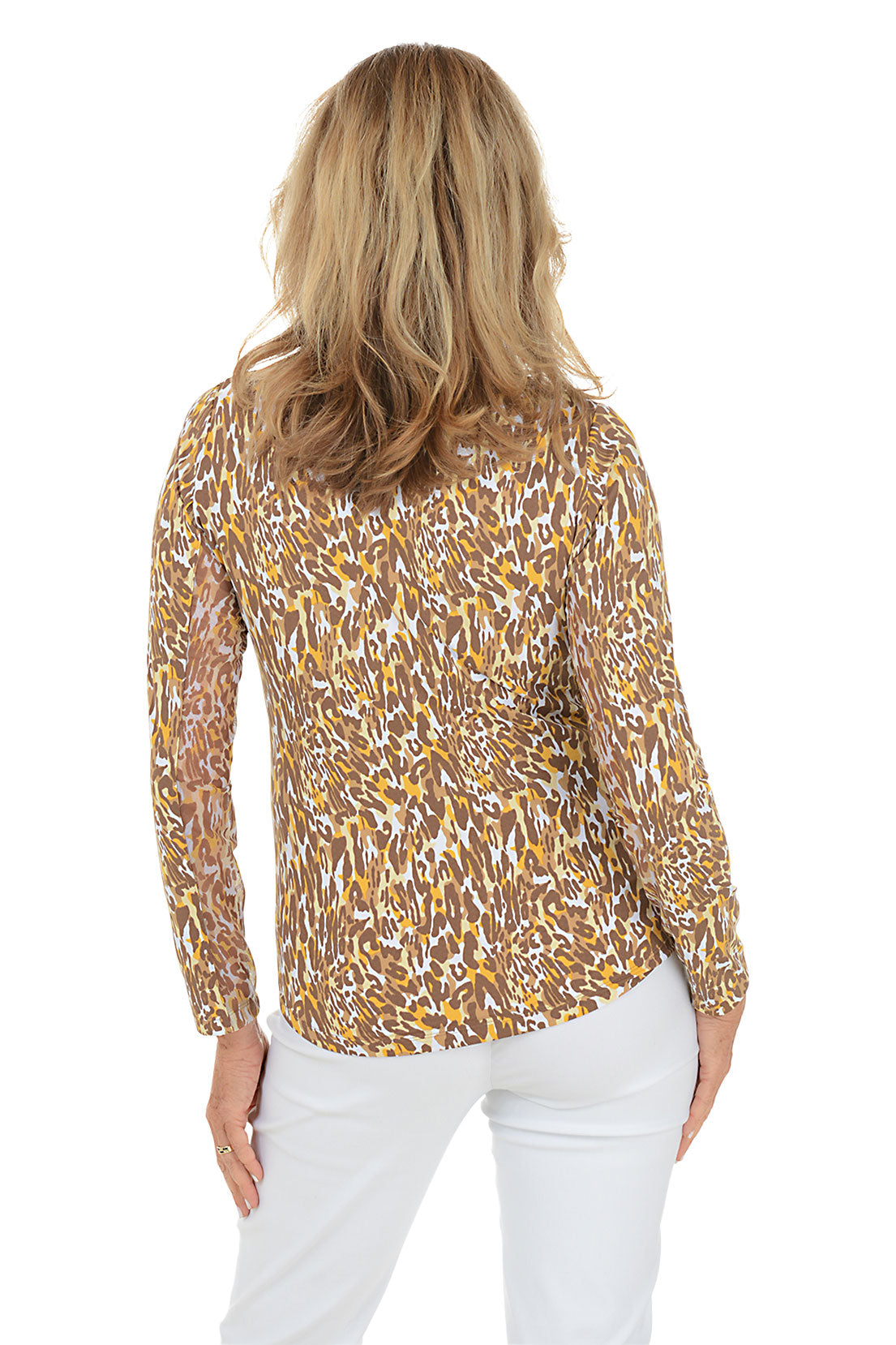 Woman wearing a patterned blouse with long sleeves on a white background. Back shot.
